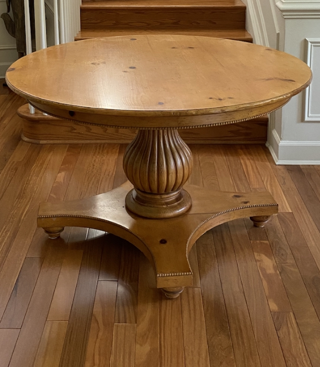 Pedestal dining table on hardwood