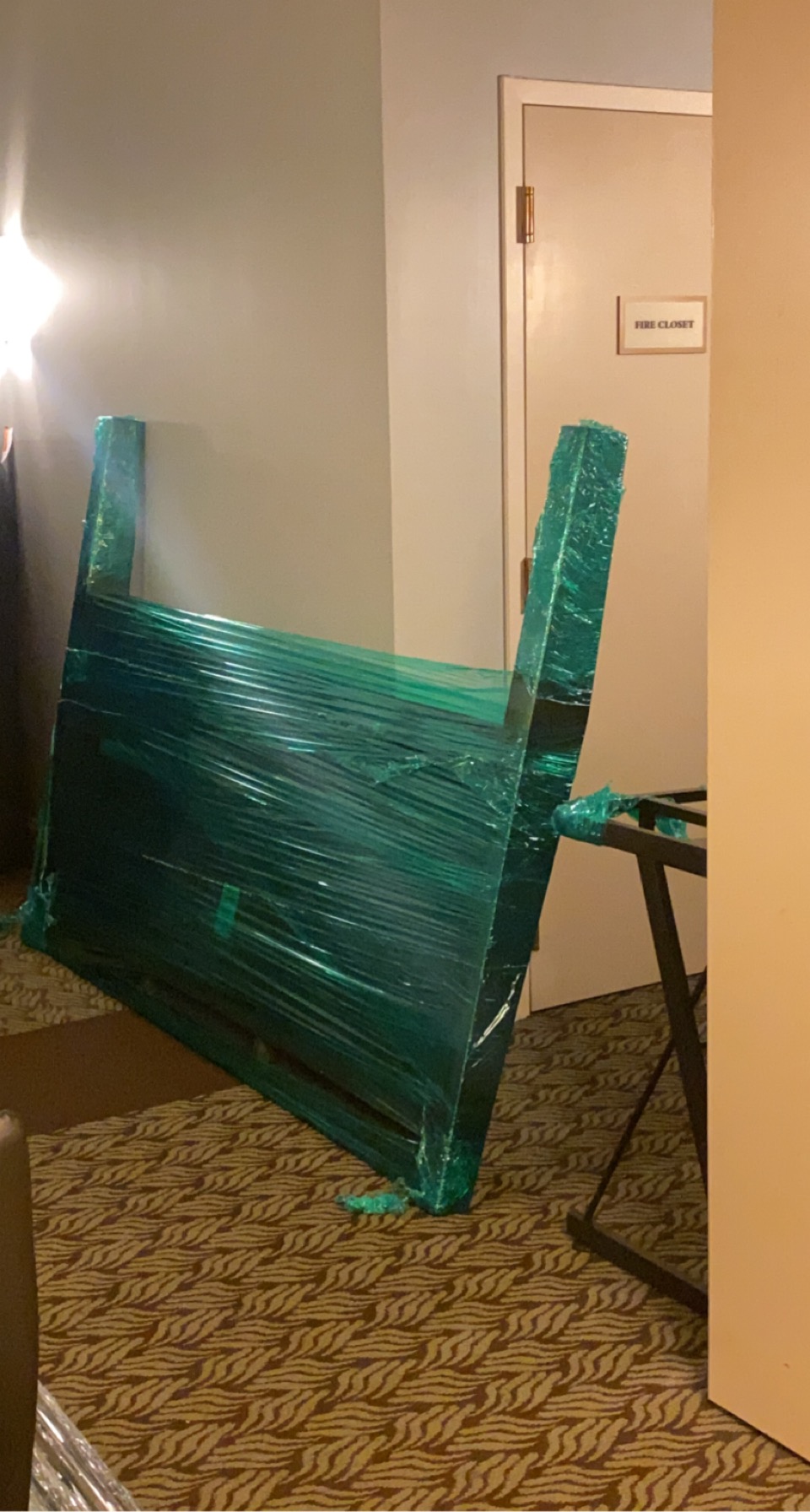 Executive desk filmed in green, hotel corridor