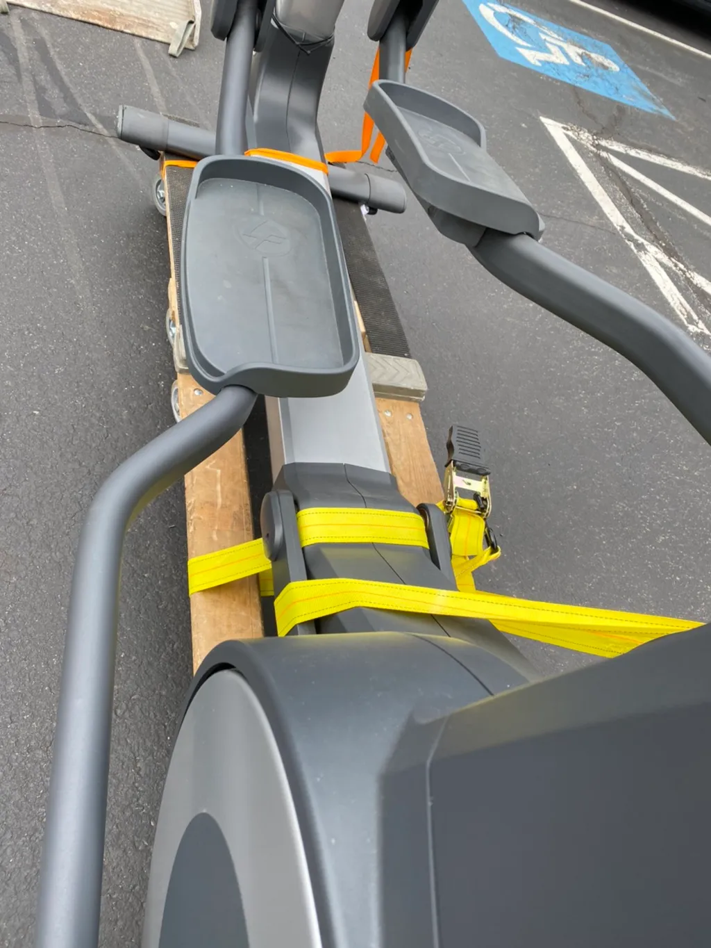 Ratchet straps on the elliptical rail